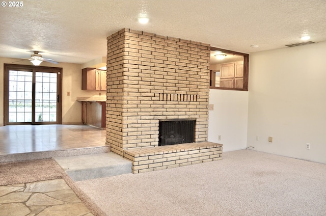 5207 NE 56th Way, Vancouver, WA 98661 - unfurnished living room with a textured ceiling, a brick fireplace, a ceiling fan, and carpet floors