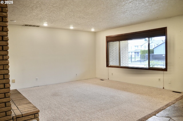 5207 NE 56th Way, Vancouver, WA 98661 - empty room featuring carpet flooring, a textured ceiling, and recessed lighting
