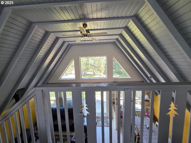interior details featuring a ceiling fan and wood ceiling