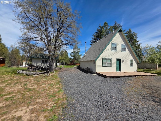 view of side of home featuring a deck
