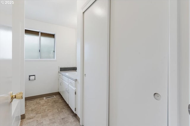 10700 NE 46th St, Vancouver, WA 98682 - bathroom with vanity, stone finish flooring, baseboards, and a tub