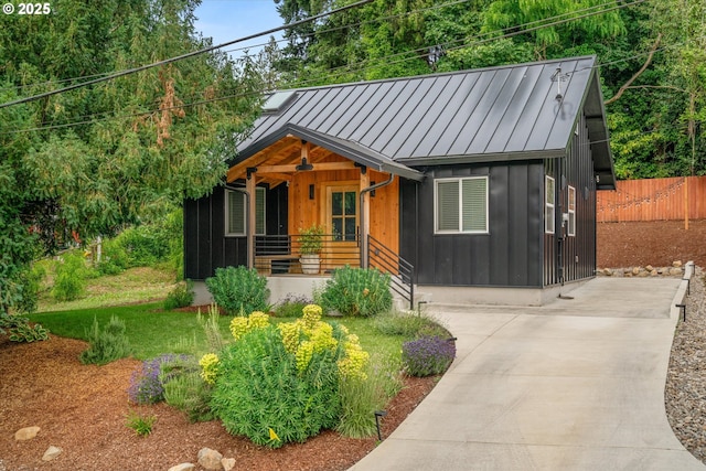 12718 SE 28th Ave, Milwaukie, OR 97222 - view of front facade featuring covered porch, a standing seam roof, board and batten siding, and a metal roof