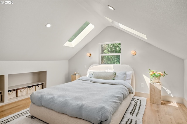12718 SE 28th Ave, Milwaukie, OR 97222 - bedroom featuring a skylight, wood finished floors, lofted ceiling, and recessed lighting
