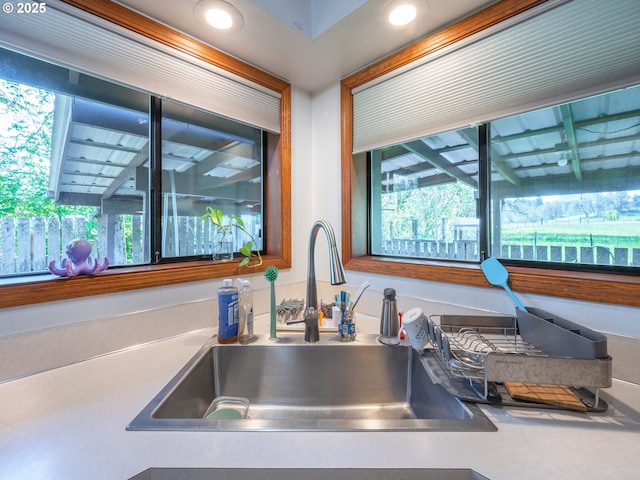details with a sink and recessed lighting
