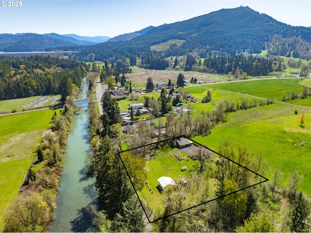 aerial view with a rural view, a forest view, and a mountain view