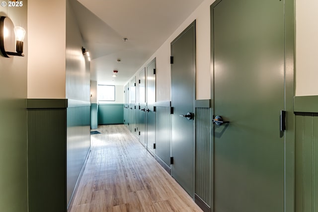 corridor with light wood-type flooring