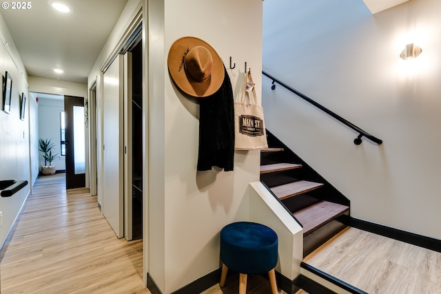 staircase featuring hardwood / wood-style floors