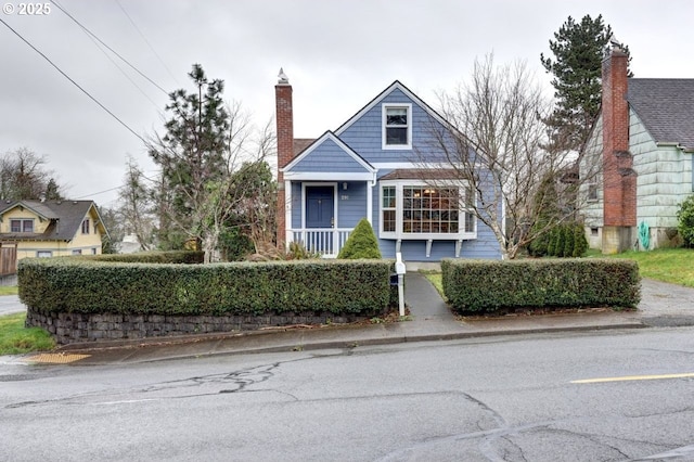 view of front of house featuring a chimney