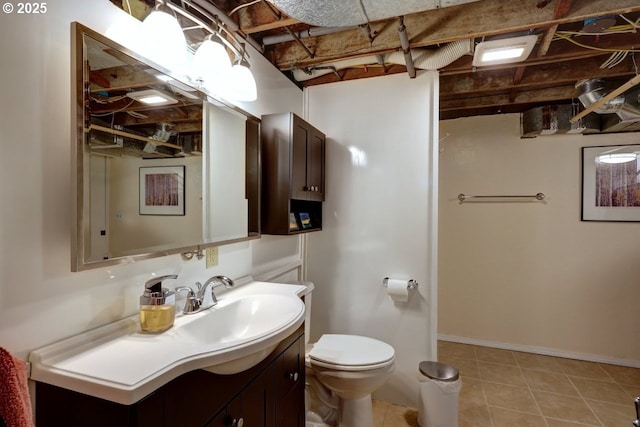 bathroom featuring toilet and vanity