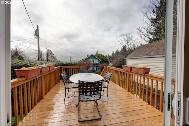 wooden deck with outdoor dining space