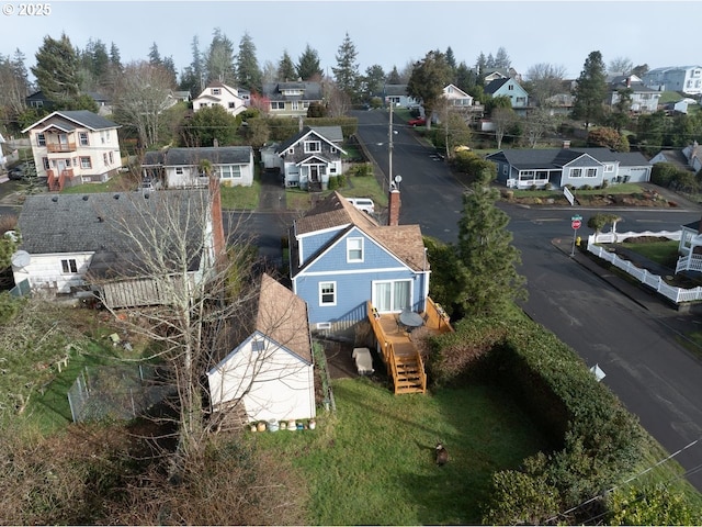 birds eye view of property with a residential view