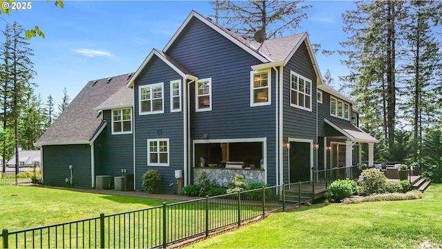 5441 NW Rubicon Ln, Portland, OR 97229 - view of home's exterior with a fenced backyard and a shingled roof