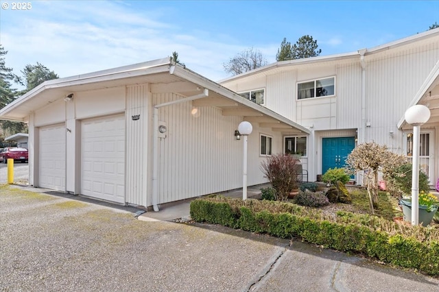 view of front of property with a garage and driveway