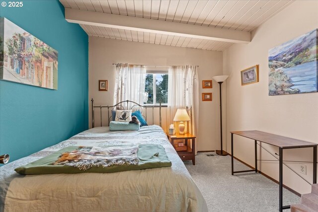 bedroom with wood ceiling, vaulted ceiling with beams, baseboards, and carpet floors