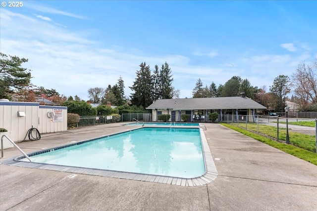 community pool featuring a patio area and fence