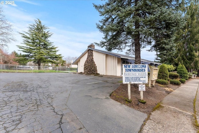 view of property with fence