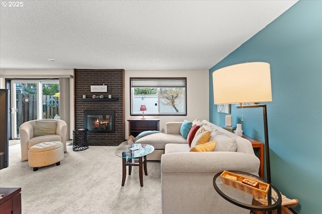 carpeted living area with a textured ceiling and a brick fireplace