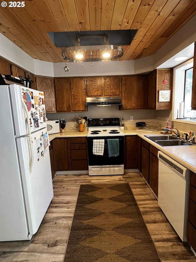 475 Burnham Ave, Maupin, OR 97037 - kitchen with white appliances, under cabinet range hood, a sink, wood ceiling, and light countertops
