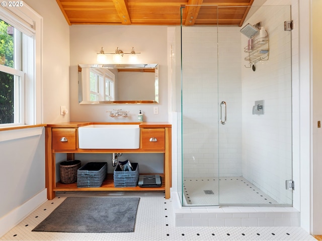 full bathroom with a shower stall, wood ceiling, baseboards, vanity, and beam ceiling