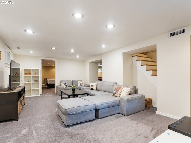 carpeted living room featuring recessed lighting, stairs, and baseboards