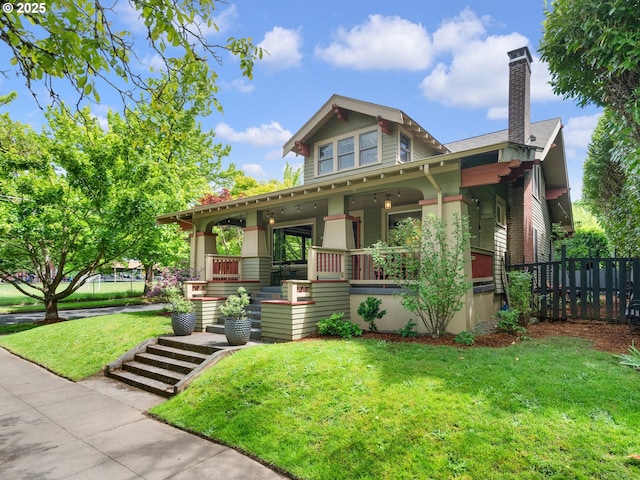 view of front of house featuring a porch and a chimney