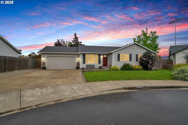 single story home featuring a garage and driveway