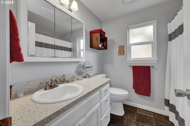 bathroom featuring vanity, toilet, baseboards, tile patterned flooring, and a shower with shower curtain