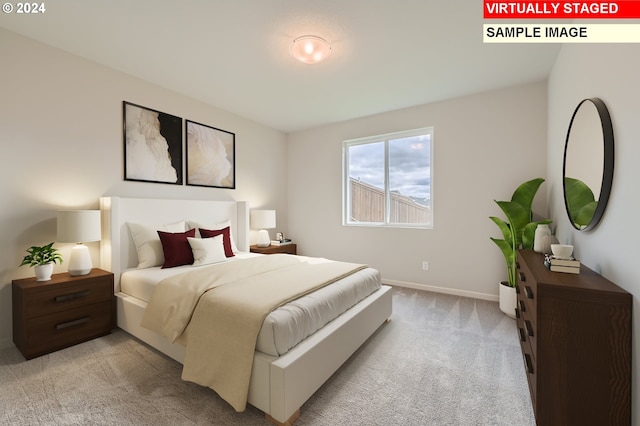 bedroom with baseboards and light carpet