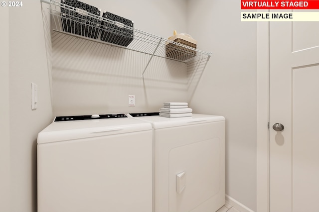 laundry room featuring laundry area, baseboards, and independent washer and dryer