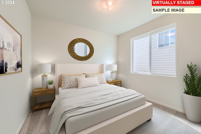 carpeted bedroom with baseboards