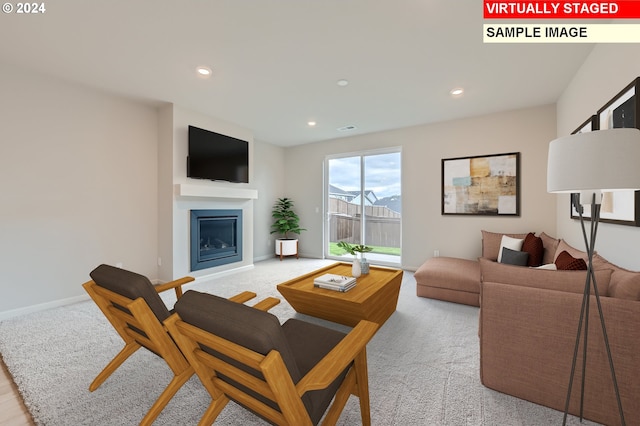 living room with visible vents, recessed lighting, a fireplace, and baseboards