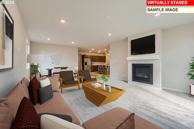 living room featuring light carpet, recessed lighting, and baseboards