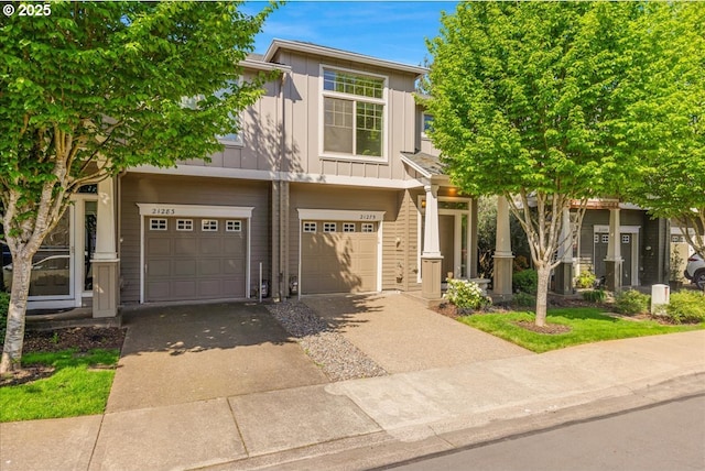 view of front of house with an attached garage, driveway, and board and batten siding