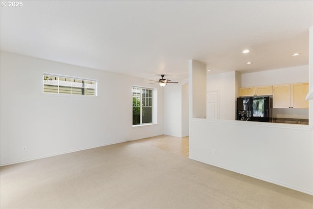 unfurnished living room featuring recessed lighting, a ceiling fan, and light colored carpet