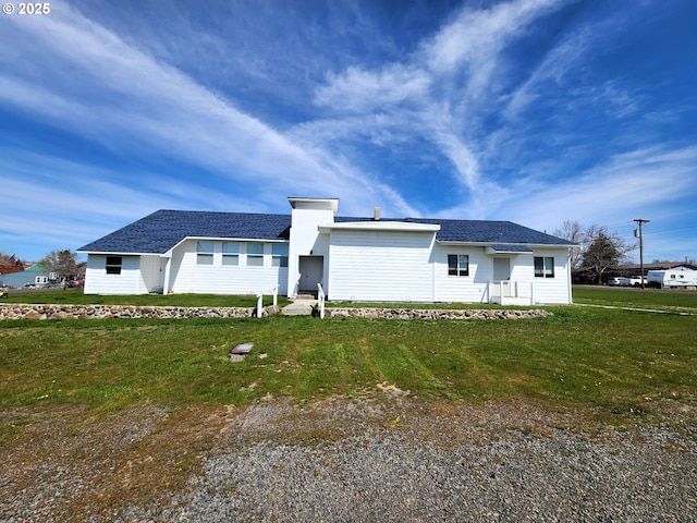 view of front of home with a front yard