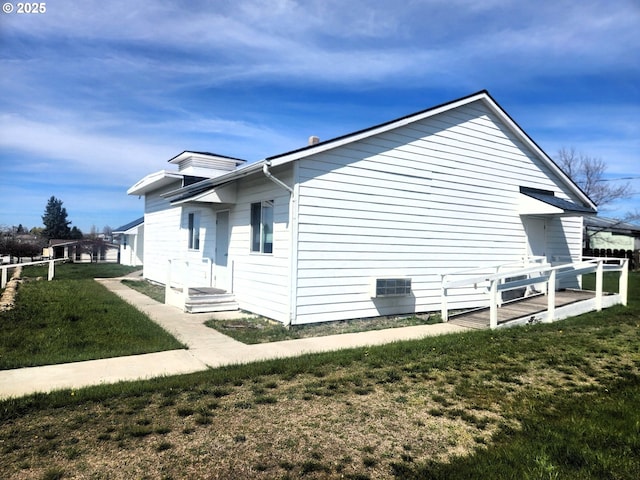 view of home's exterior featuring a lawn