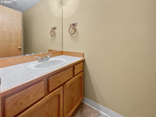 bathroom featuring vanity and baseboards