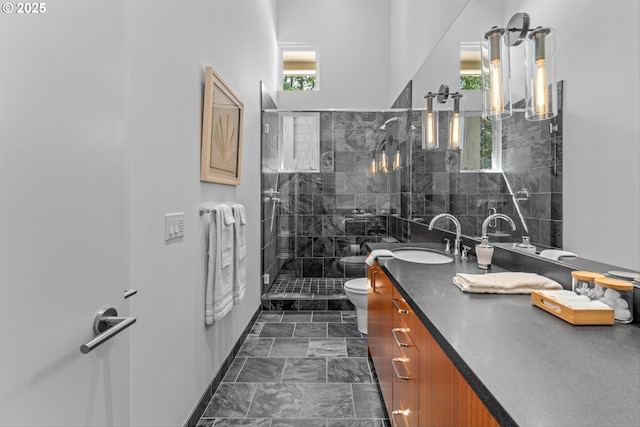 4140 NW Thunder Crest Rd, Portland, OR 97229 - full bathroom featuring toilet, vanity, and tiled shower