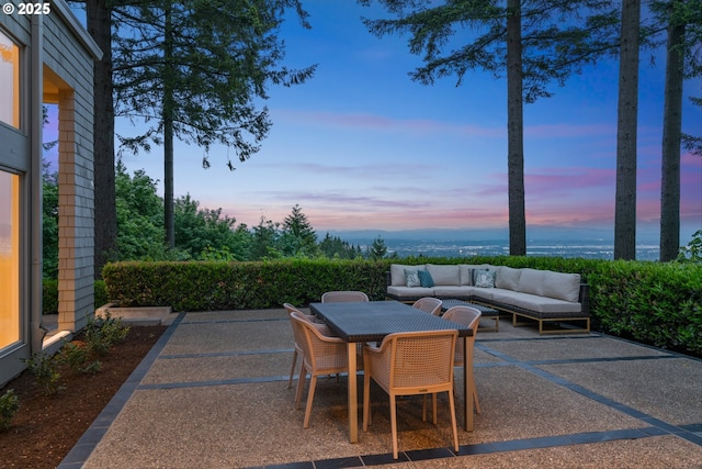 4140 NW Thunder Crest Rd, Portland, OR 97229 - patio terrace at dusk featuring a patio area, outdoor lounge area, outdoor dining area, and a water view