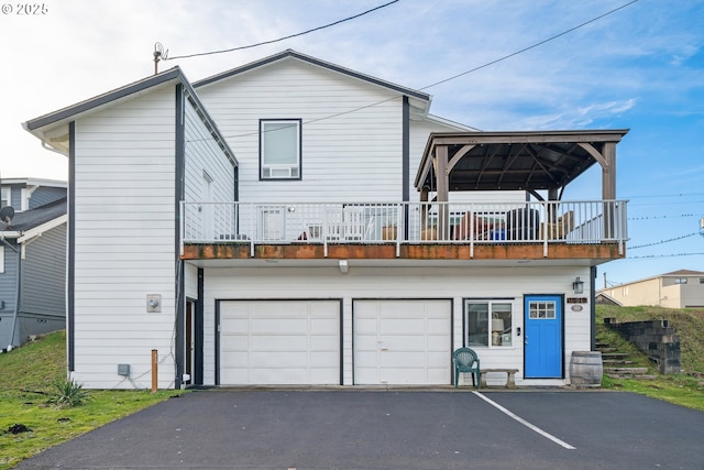 view of front of house with a garage and a gazebo