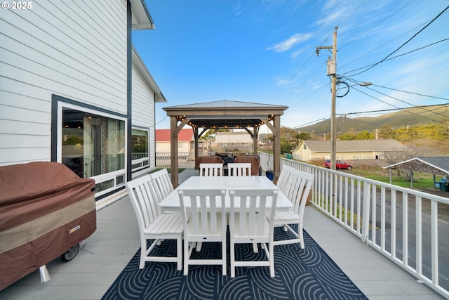 wooden deck featuring a gazebo