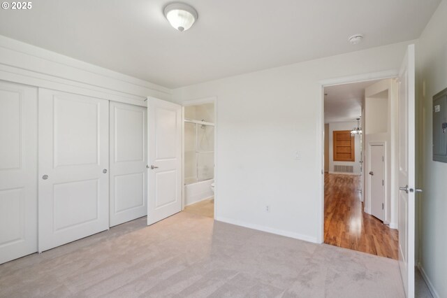 5264 NE 121st Ave Unit K67, Vancouver, WA 98682 - unfurnished bedroom with light colored carpet, a closet, baseboards, and connected bathroom