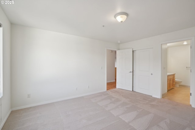 5264 NE 121st Ave Unit K67, Vancouver, WA 98682 - unfurnished bedroom with light colored carpet, baseboards, a closet, and connected bathroom
