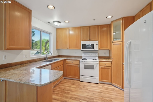 5264 NE 121st Ave Unit K67, Vancouver, WA 98682 - kitchen featuring white appliances, a sink, a peninsula, recessed lighting, and light wood finished floors