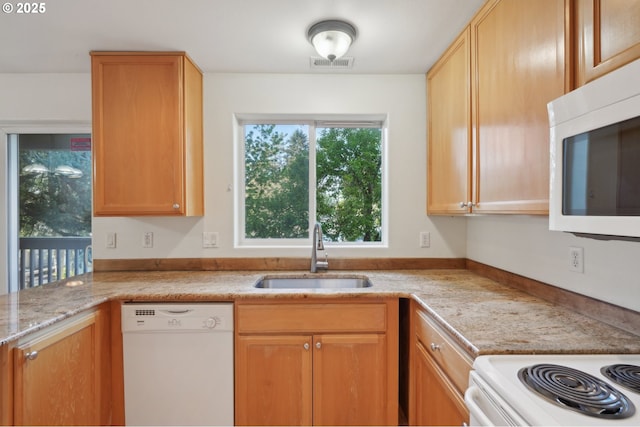 5264 NE 121st Ave Unit K67, Vancouver, WA 98682 - kitchen featuring white appliances, a sink, and light stone counters