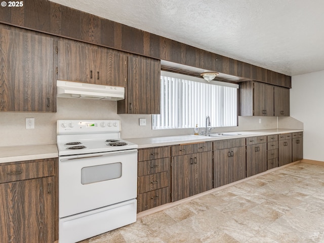 7804 NW 1st Ave, Vancouver, WA 98665 - kitchen featuring white electric stove, under cabinet range hood, light countertops, and a textured ceiling