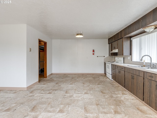 7804 NW 1st Ave, Vancouver, WA 98665 - kitchen with electric stove, light countertops, under cabinet range hood, stone finish flooring, and a textured ceiling