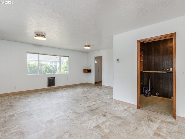 7804 NW 1st Ave, Vancouver, WA 98665 - empty room with a textured ceiling and heating unit
