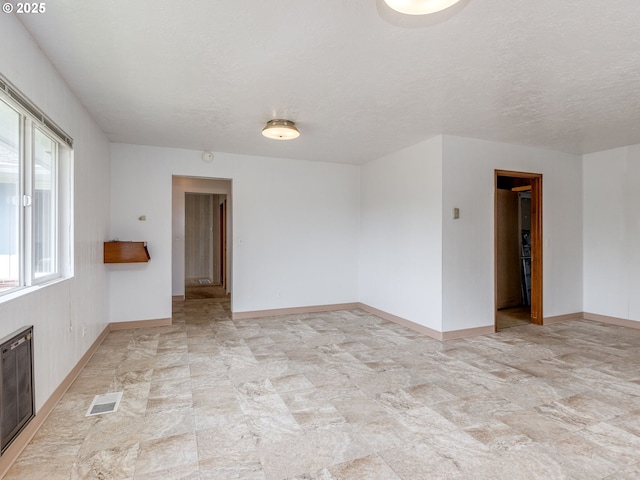 7804 NW 1st Ave, Vancouver, WA 98665 - unfurnished room featuring stone finish flooring and a textured ceiling