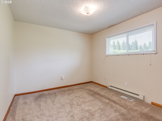 7804 NW 1st Ave, Vancouver, WA 98665 - unfurnished room featuring a baseboard heating unit, light carpet, and a textured ceiling